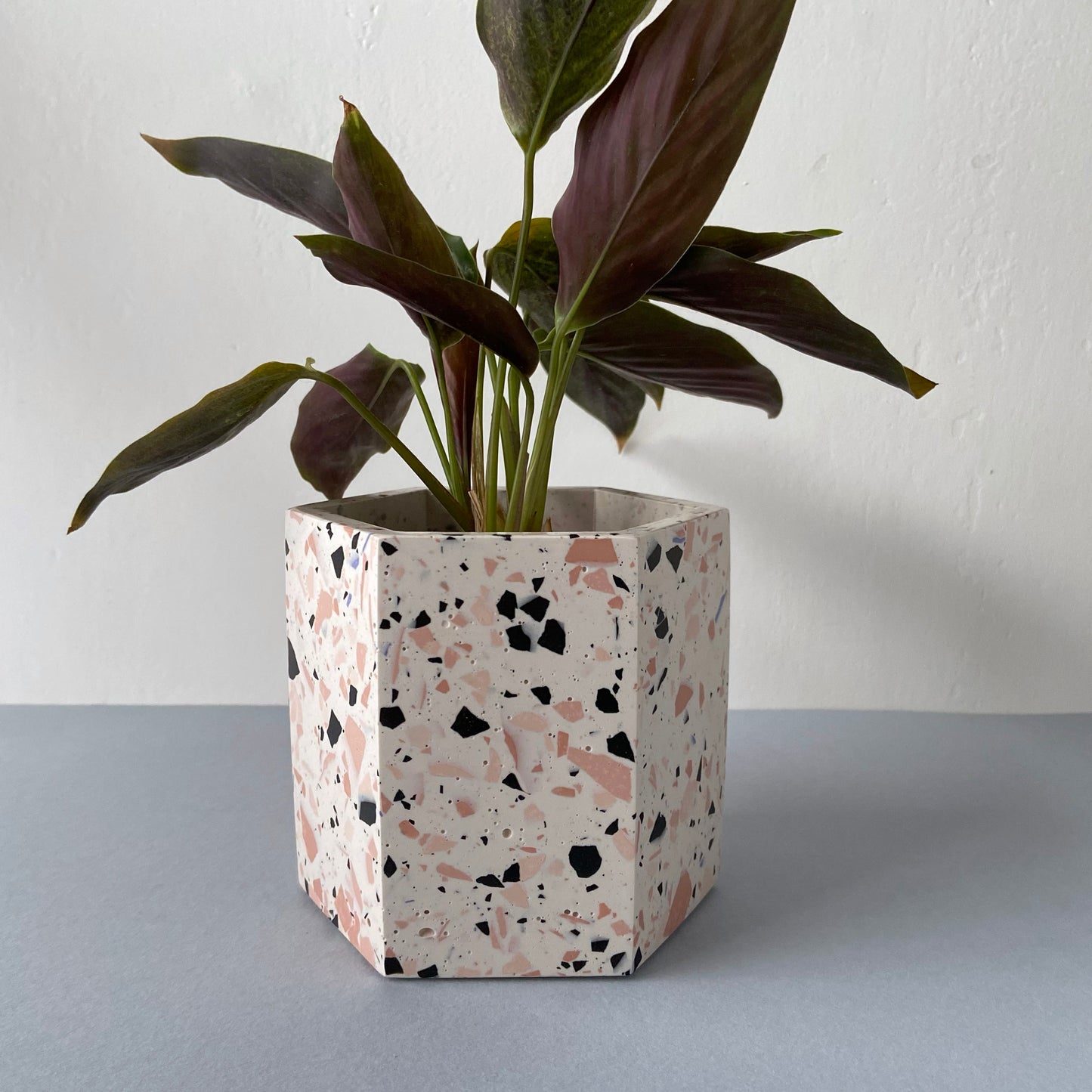 Large terrazzo plant pot in pink tones